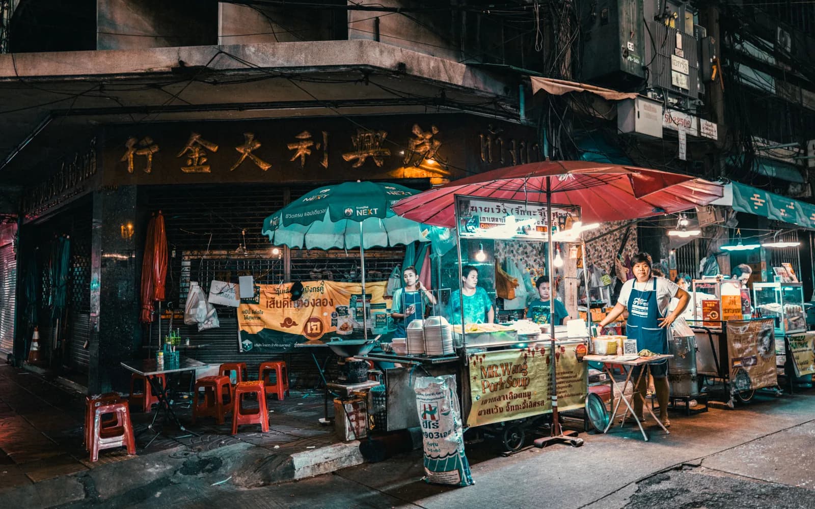 A night market in Thailand with street food vendors and crowds