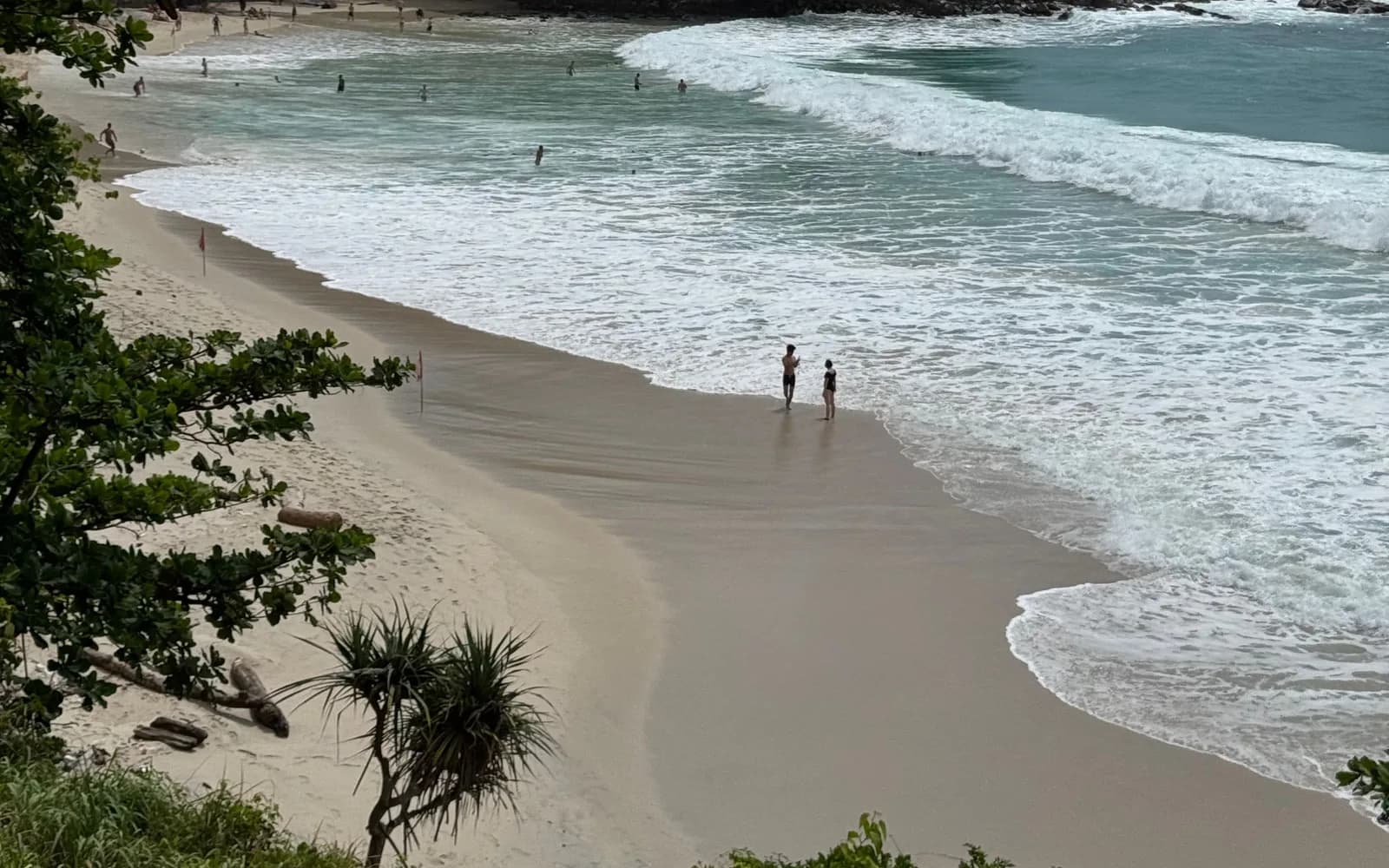 Kata Noi Beach in Phuket, green hills running down to the water