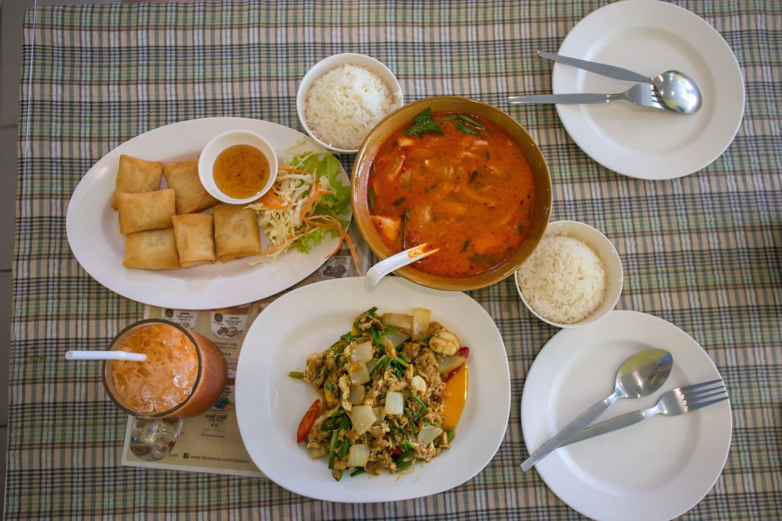 Thai curry and rice laid out on a table