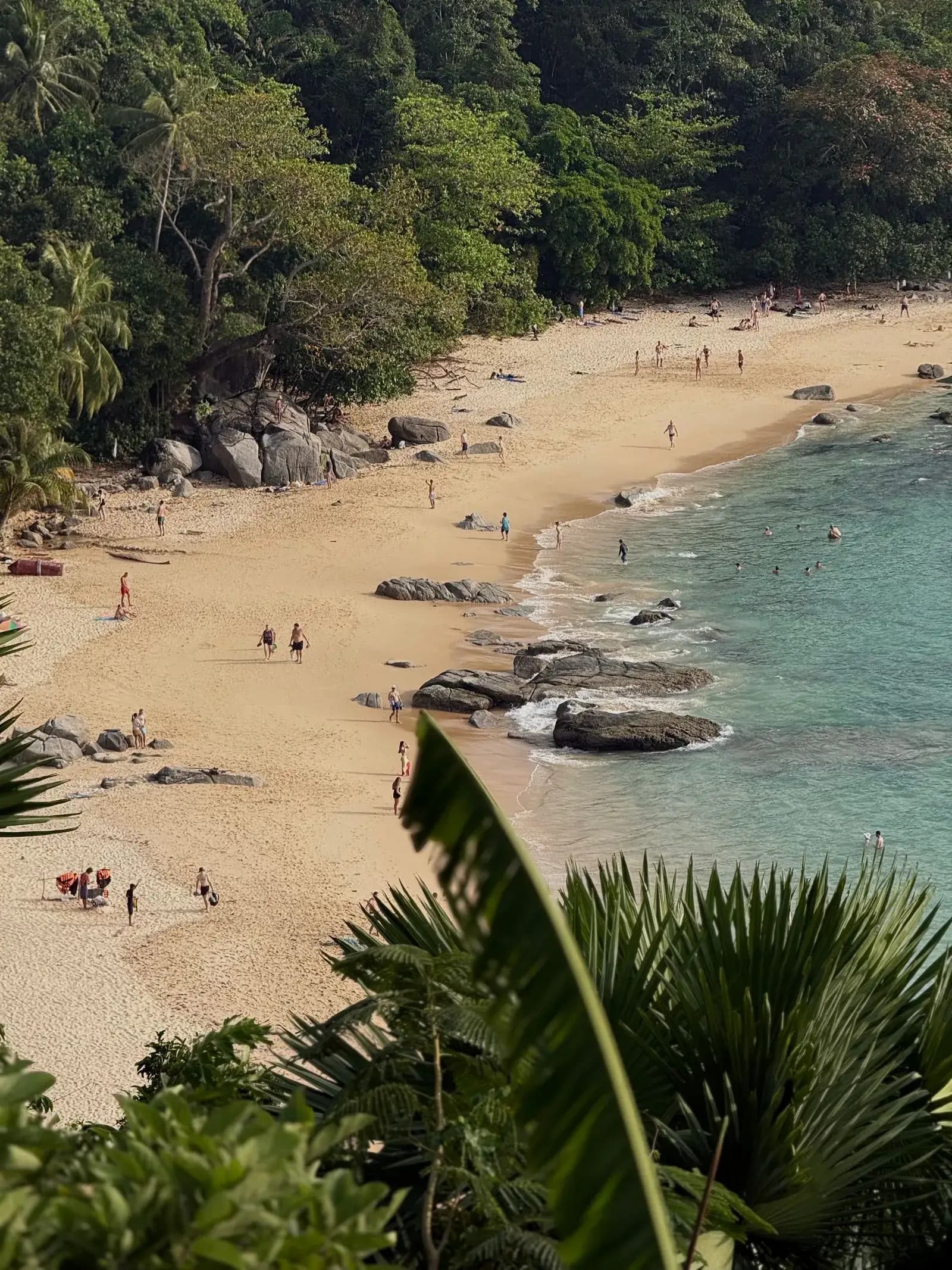 Turquoise water meeting pale sand on a Phuket beach