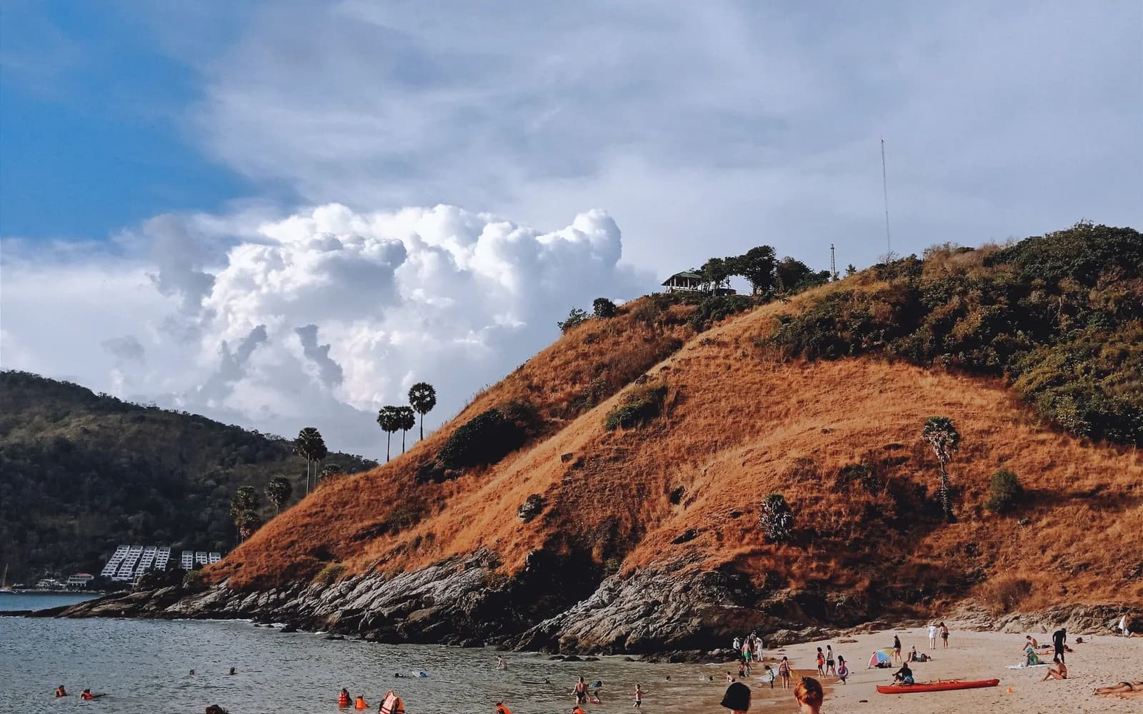 Ya Nui Beach with people relaxing on a sunny day in Phuket, Thailand.
